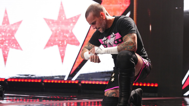 CM Punk checks the time
