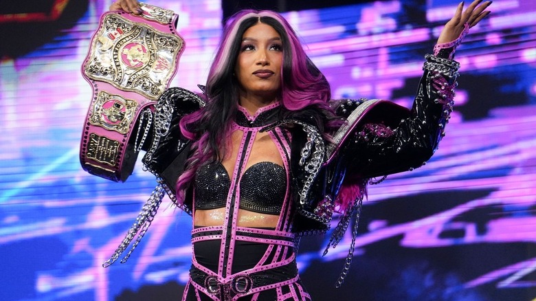 Mercedes Moné holding up the women's Owen Hart title