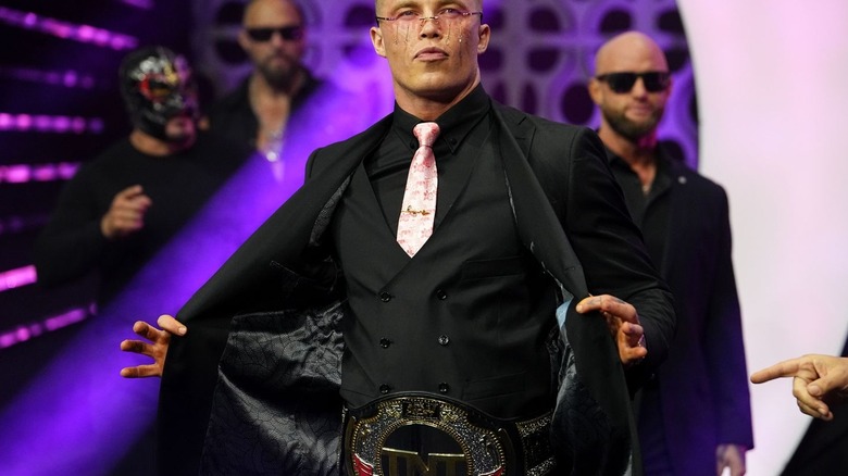 Kyle Fletcher flashes his TNT title