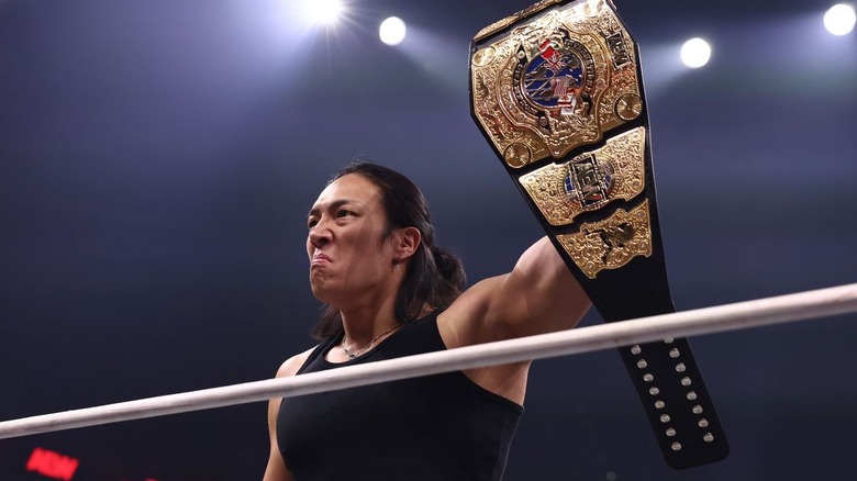 Konosuke Takeshita holding up the International Championship