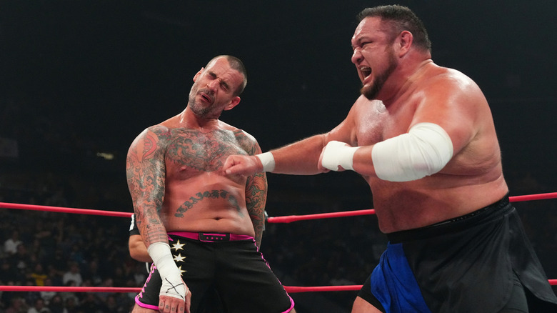 Samoa Joe striking CM Punk 