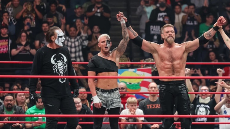 Sting, Darby Allin, and Adam Copeland celebrate glorious victory
