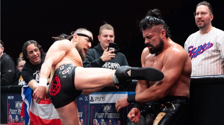 Bryan Danielson kicks Andrade El Idolo in the chest