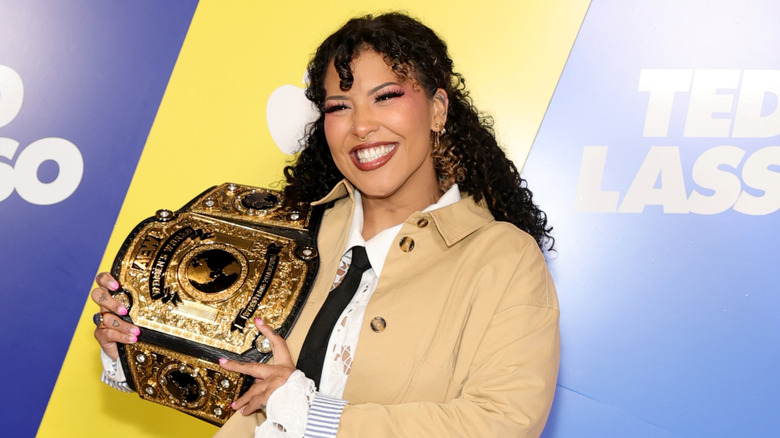 Willow Nightingale with the AEW Women's Title at the Ted Lasso premiere