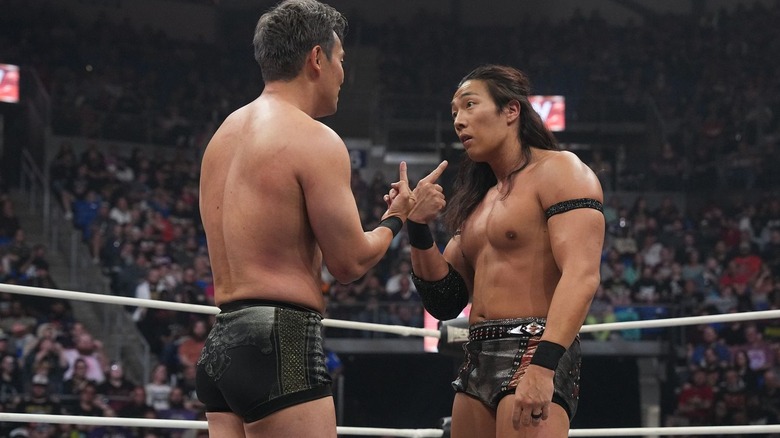 Okada & Takeshita pointing at each other
