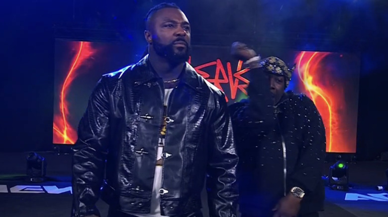 Swerve Strickland makes his entrance with the dancing Prince Nana.