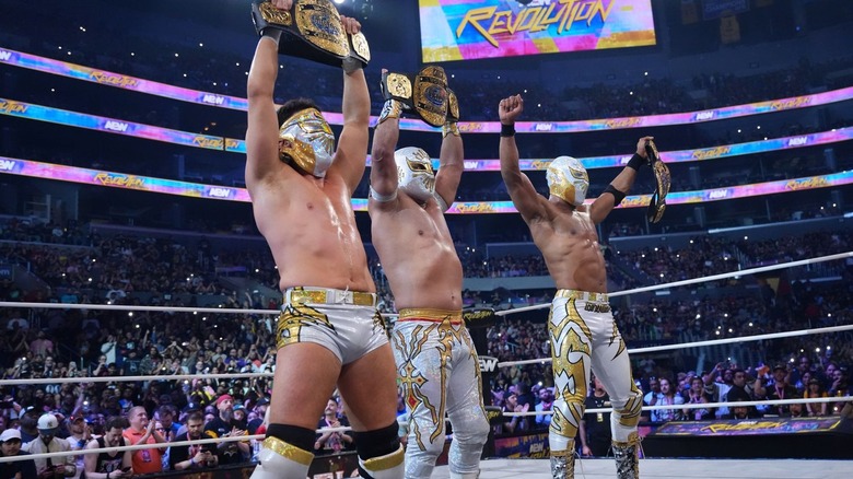 JetSpeed and Mistico celebrate with AEW Trios titles