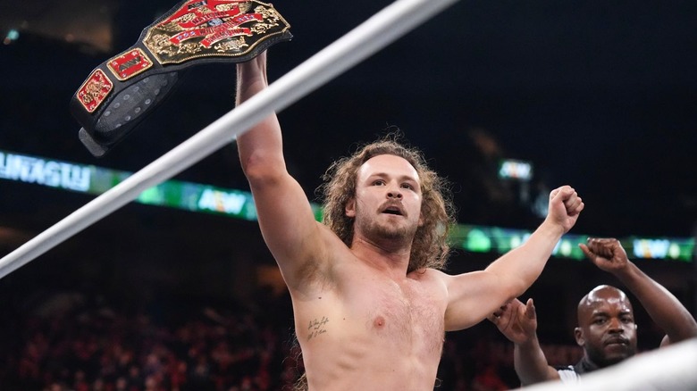 Jack Perry holds the National Championship above his head