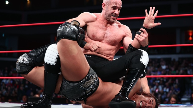 Claudio Castagnoli puts Konosuke Takeshita in a submission