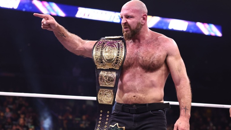 Jon Moxley with the Continental title over his shoulder