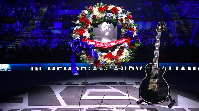 The Butcher's guitar with a flower wreath and photo