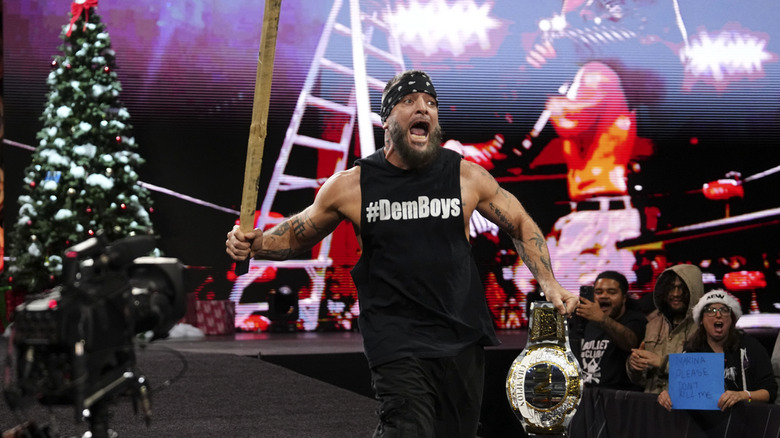 TNT Champion Mark Briscoe heads down to the ring, armed with a bat, during 