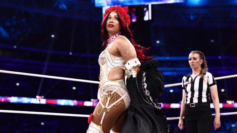 Mercedes Mone poses in the ring as she sheds her ring coat before her AEW Women's World Championship match against Willow Nightingale at AEW All In London 2026.