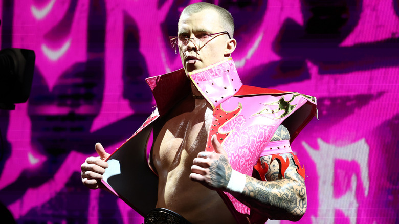 Kyle Fletcher wearing a pink jacket and sunglasses