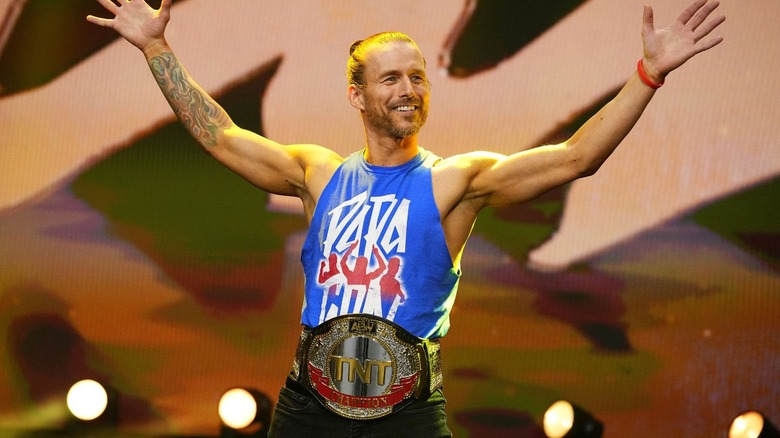 TNT Champion Adam Cole poses on the stage before a segment on "AEW Collision."