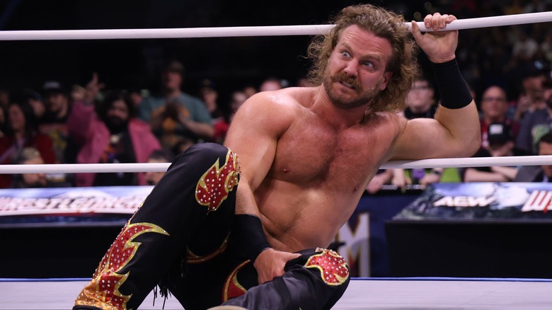 Hangman Page looks crazed, as he clutches the ropes