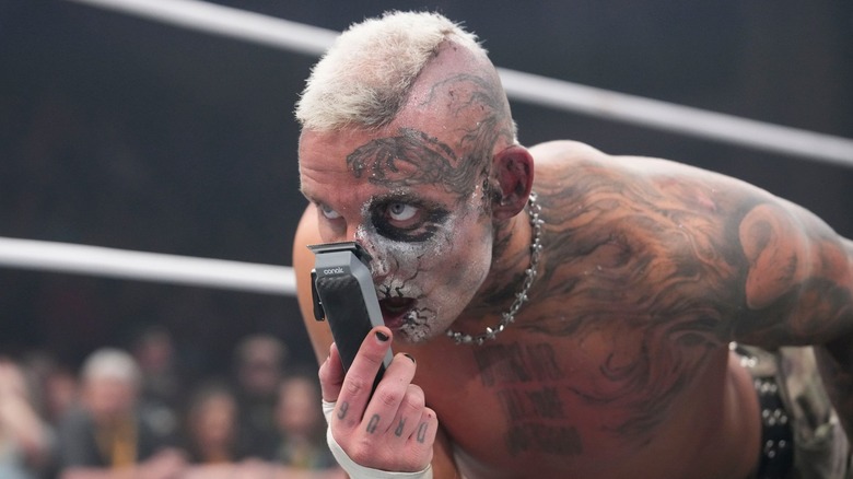 Darby Allin with a shaver in the ring