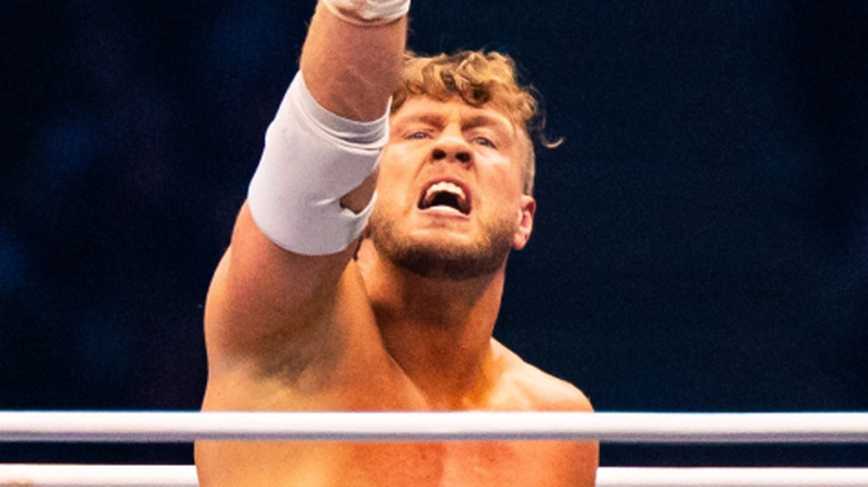 Will Ospreay pointing to the sky