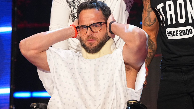 Roderick Strong covers his ears