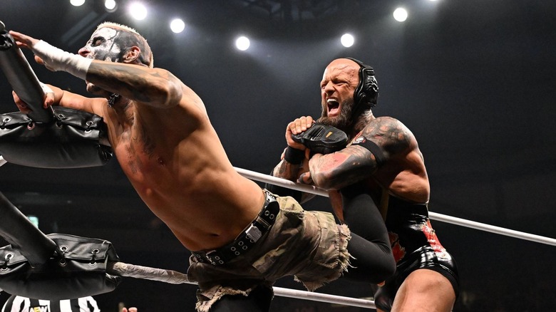 Josh Alexander locks Darby Allin in a hold in the ropes on "AEW Dynamite"