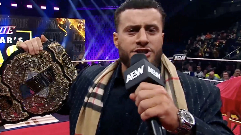 MJF showing off the AEW World Championship belt to the camera