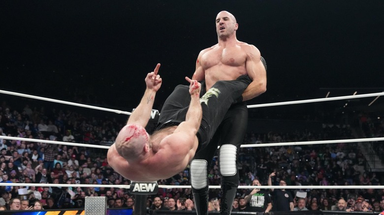 Jon Moxley flips off Claudio Castagnoli, mid-spin