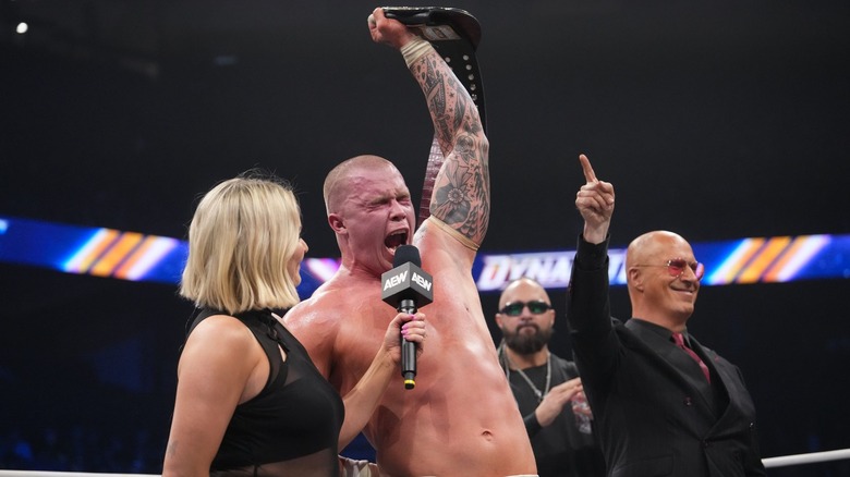 Kyle Fletcher celebrates with the AEW TNT Championship
