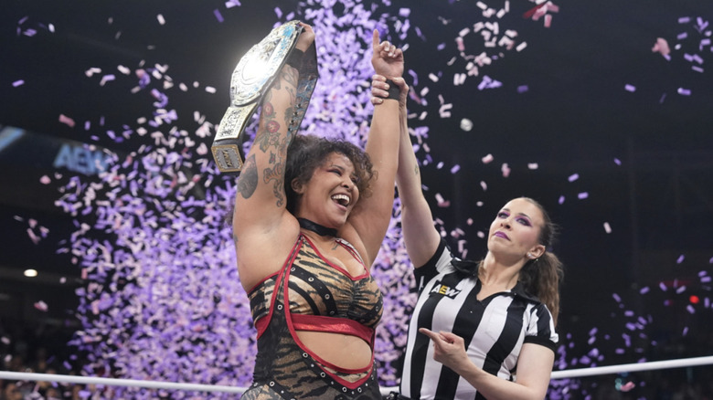 Nightingale holding up her TBS Championship