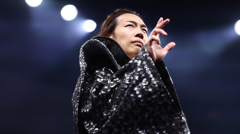 Konosuke Takeshita poses in the ring and looks to the crowd before a match on "AEW Collision."