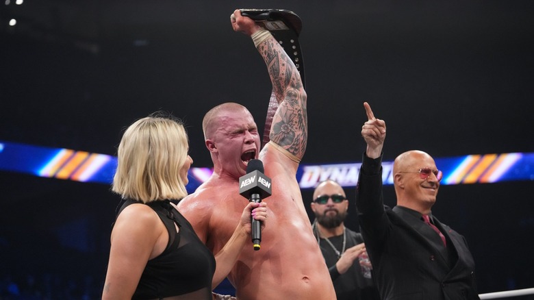 Kyle Fletcher celebrates with the AEW TNT Title