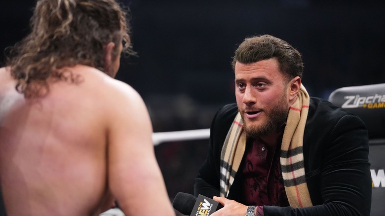 MJF sits across from Kenny Omega