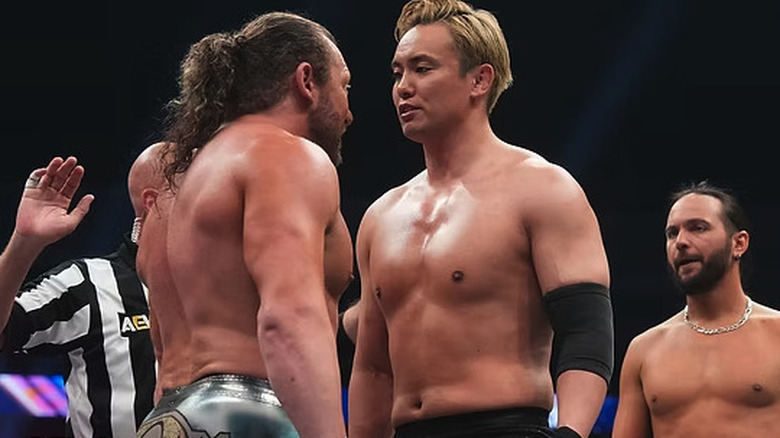 Kenny Omega faces down Kazuchika Okada while Matt Jackson looks on on "AEW Dynamite"
