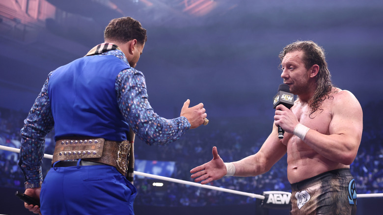 Kenny Omega offers AEW World Champion MJF a hand to shake during an in-ring promo segment on "AEW Dynamite."