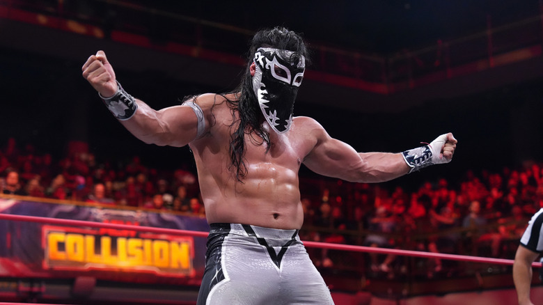 Bandido poses in the ring before hitting a move during a match on "AEW Collision."