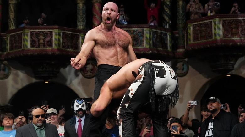 Jon Moxley battles Adam Page outside the ring on "AEW Dynamite"