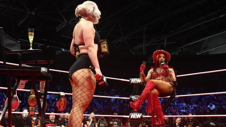 Mercedes Mone sitting and talking to Toni Storm in the ring on "AEW Dynamite"