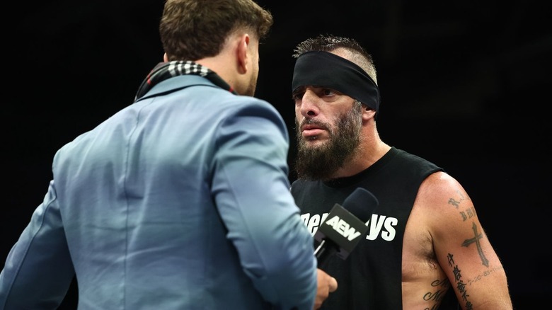 MJF and Mark staring each other down in the ring