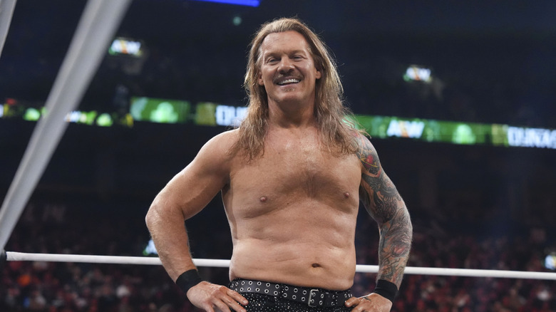 Chris Jericho looks toward the camera and smiles in the ring before his match at AEW Dynasty.