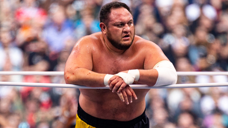 Samoa Joe leans on the ropes.