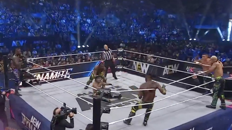 All six men inside and around the ring