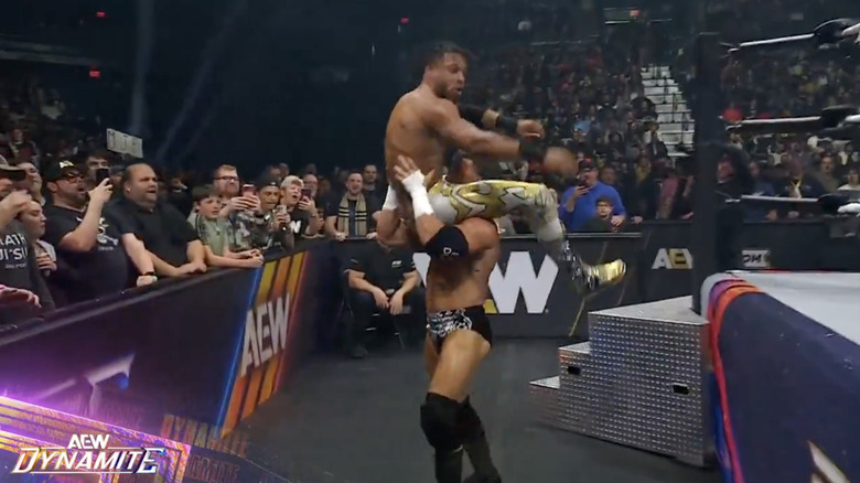 MJF about to powerbomb Knight on one of the barricades