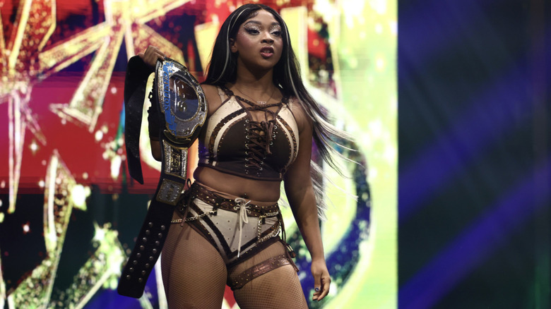 World on the entrance ramp holding up her TBS Championship