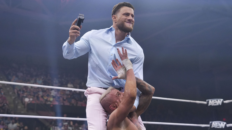 MJF holding a razor over Darby Allin