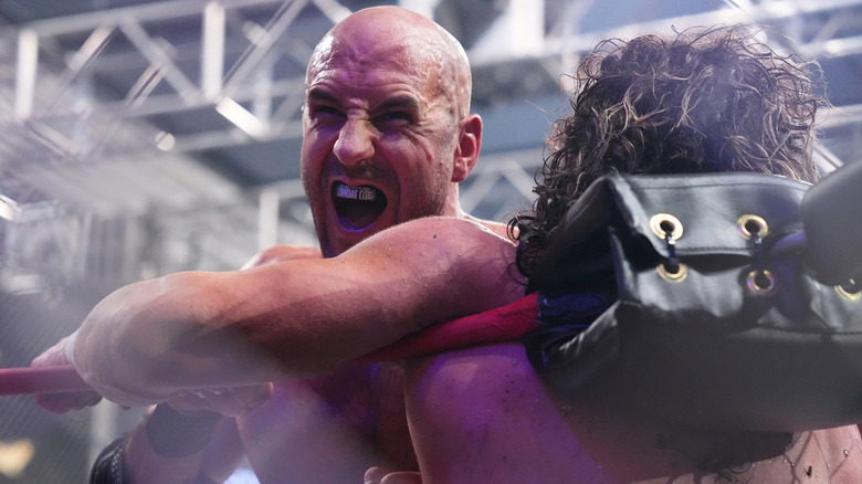 Claudio Castagnoli menaces Kenny Omega during Blood and Guts on the July 19 "Dynamite"