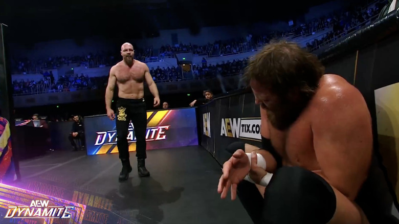 Moxley and Davis on the outside of the ring