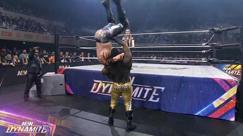 Strickland about to land a suplex on Omega