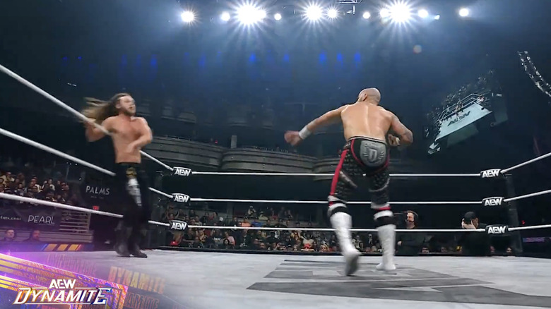 Perry and Ricochet in the ring