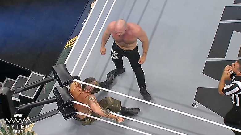 Briscoe and Moxley brawling in the corner