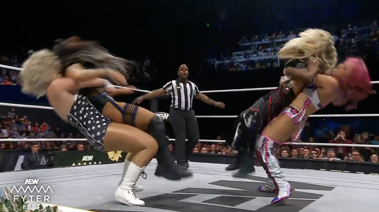 Storm and Shirakawa landing German suplexes on Blue and Hart