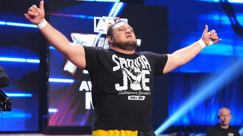 Samoa Joe holding out his arms